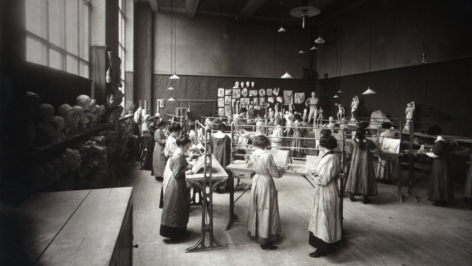 Students in workshop, early 1900's Work Description: Mounted photograph of female students in a workshop images.is.ed.ac.uk Group of mainly female students with two men, working on ornamental plasterwork in an Edinburgh College of Art studio containing casts